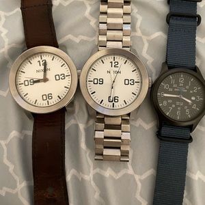 Three watch bundle. Two Nixon watches and one Timex. All work. Need batteries.